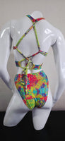 Colorful bikini on a white mannequin against a neutral background