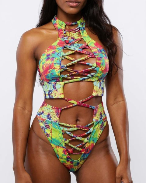 Woman wearing a colorful tie-dye bikini set on a white background