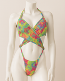 Colorful tie-dye bikini on a mannequin against a plain background